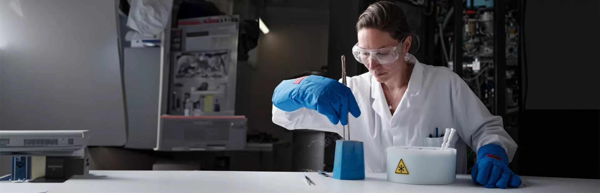 Scientist working in a lab with frozen elements