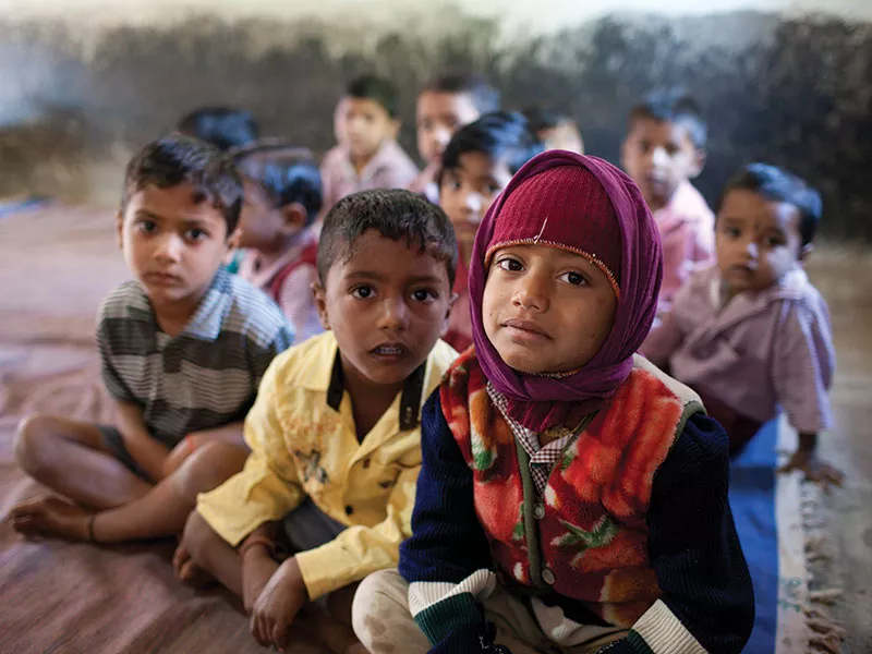 Children waiting at Arogya Parivar health camp in India