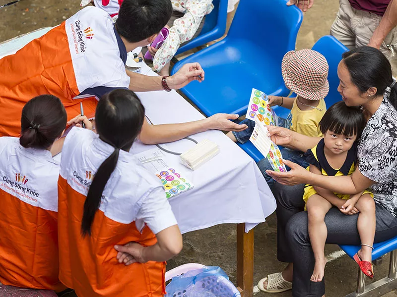 Family screening at Cùng Sông Khòe health camp in Vietnam
