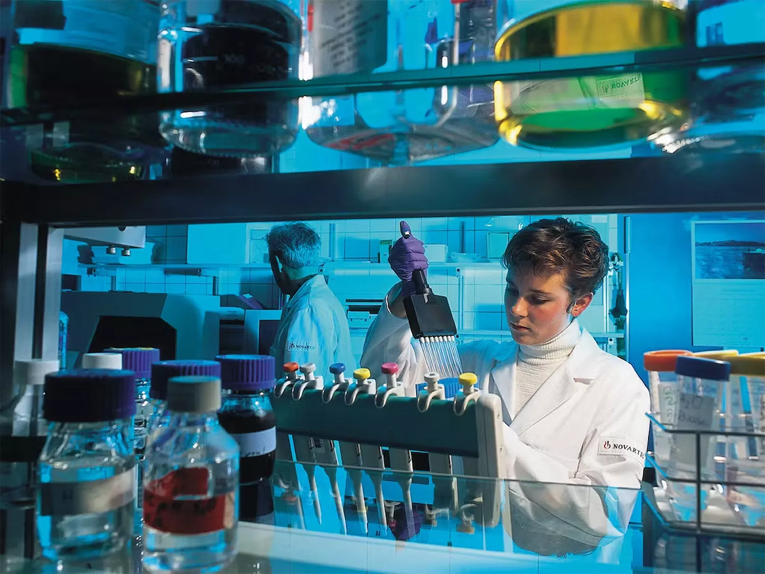 Scientist working in a colorful lab