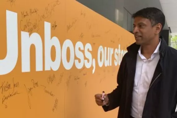 Vas Narasimhan, CEO of Novartis, in front of the unboss wall