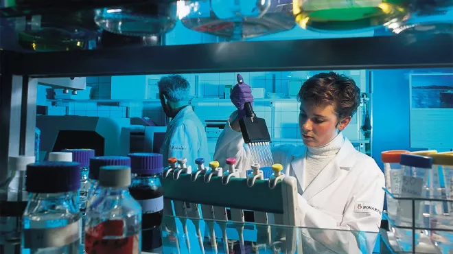 Scientist working in a colorful lab
